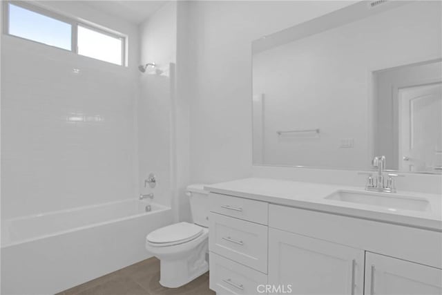 full bathroom featuring bathing tub / shower combination, vanity, toilet, and tile patterned flooring