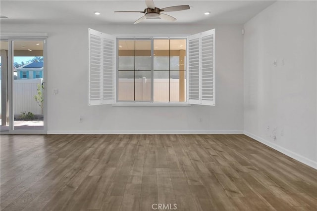 spare room featuring ceiling fan and wood-type flooring