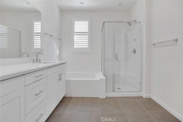 bathroom featuring independent shower and bath, tile patterned flooring, and vanity