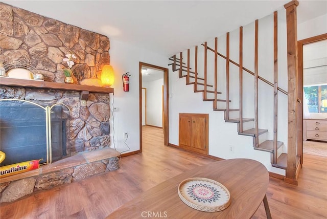 living room with a fireplace and light hardwood / wood-style floors