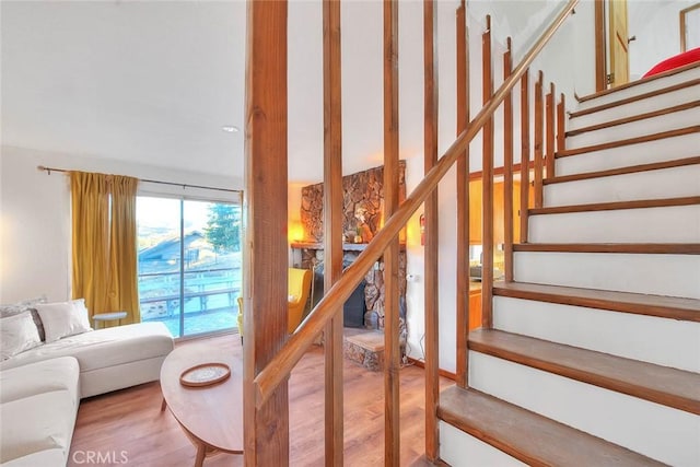 staircase featuring hardwood / wood-style flooring