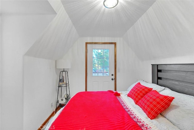 bedroom with lofted ceiling