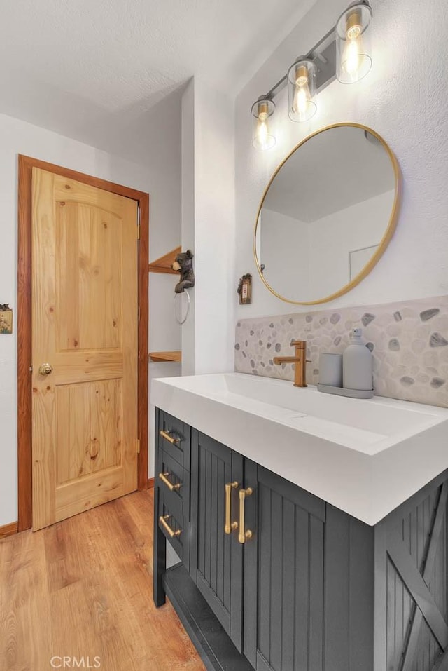 bathroom with vanity and hardwood / wood-style floors