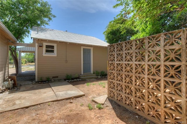 back of house with entry steps and crawl space