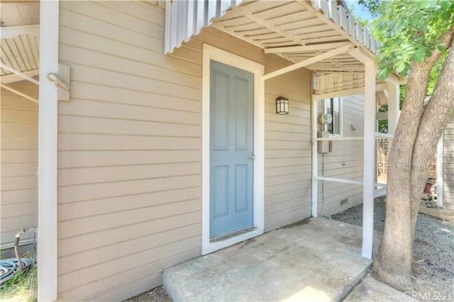 doorway to property with crawl space and a patio area