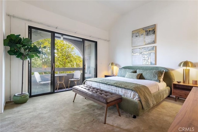 carpeted bedroom with access to exterior and vaulted ceiling