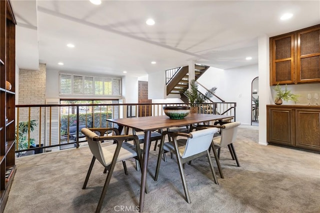 dining space with light carpet