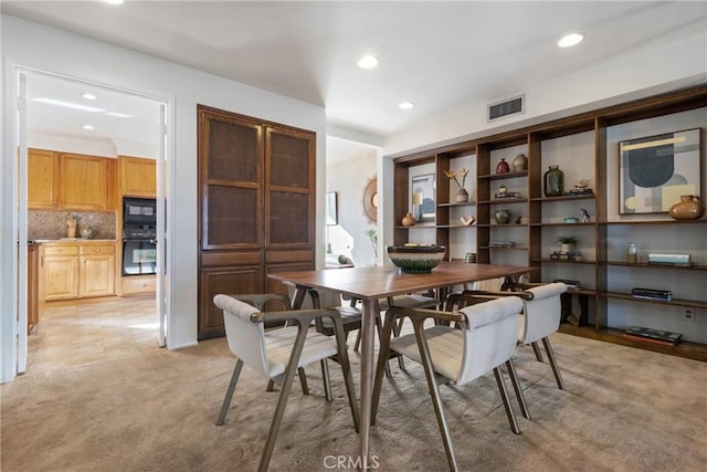 view of carpeted dining area