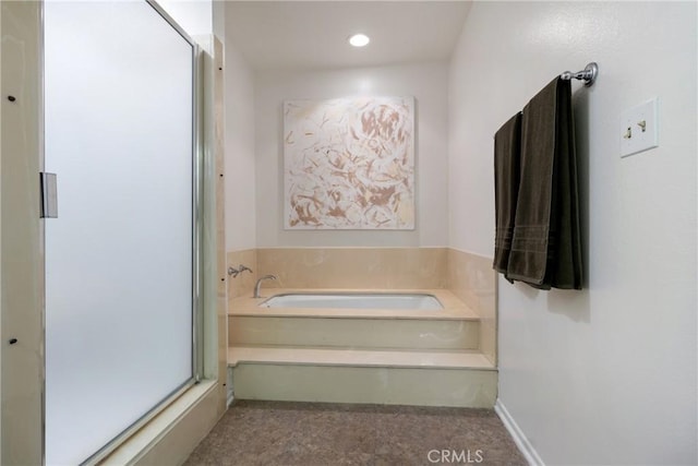 bathroom featuring a washtub