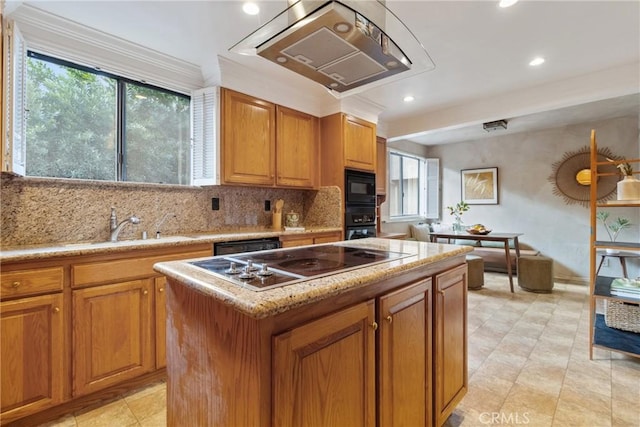 kitchen with plenty of natural light, ventilation hood, a center island, and black appliances