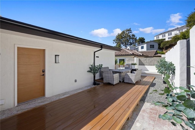 wooden deck featuring fence and outdoor dining space