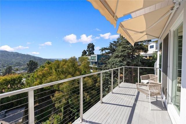 balcony featuring a mountain view