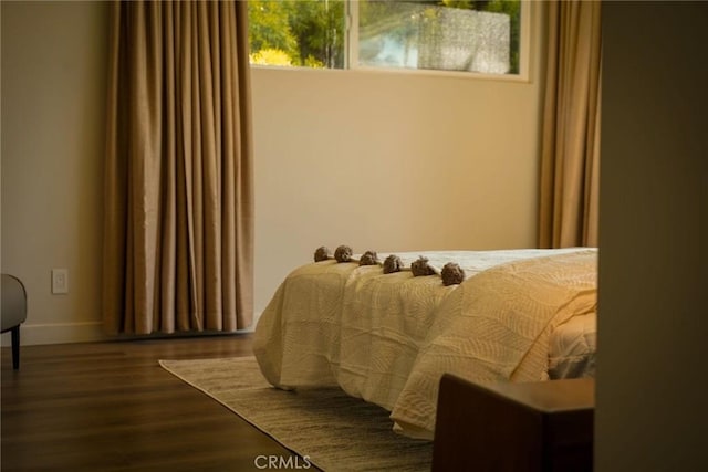 bedroom with wood finished floors