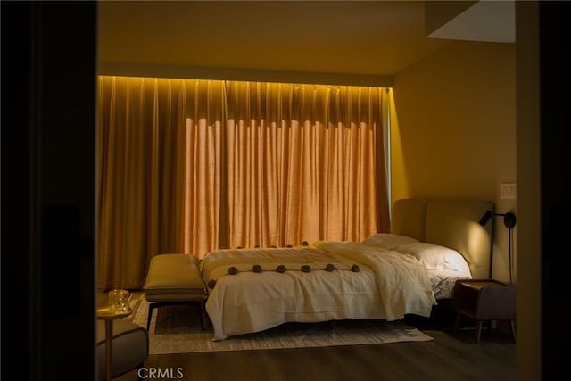 bedroom featuring wood finished floors