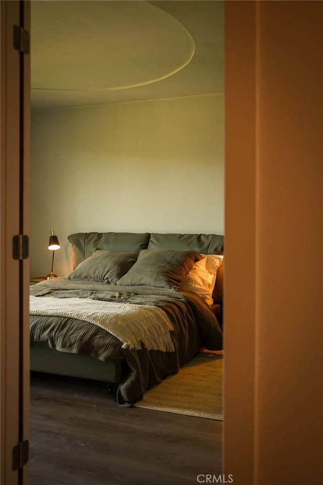 bedroom featuring wood finished floors