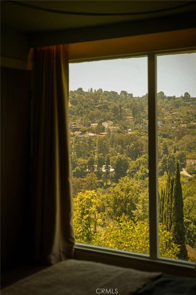 interior details featuring a wooded view