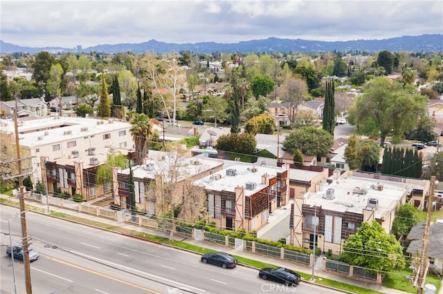 birds eye view of property with a mountain view