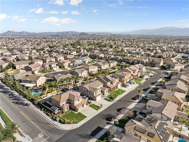 drone / aerial view featuring a residential view and a mountain view