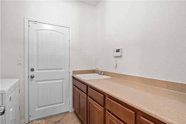 bathroom with tile patterned flooring and a sink