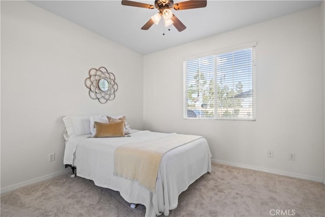 bedroom featuring carpet flooring, ceiling fan, and baseboards