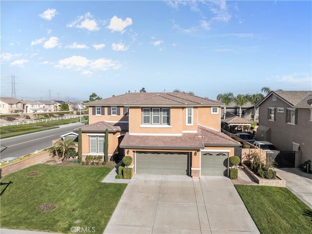 traditional home featuring a tile roof, stucco siding, an attached garage, fence, and a front lawn