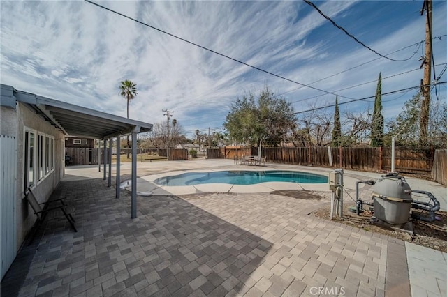 view of swimming pool with a patio area