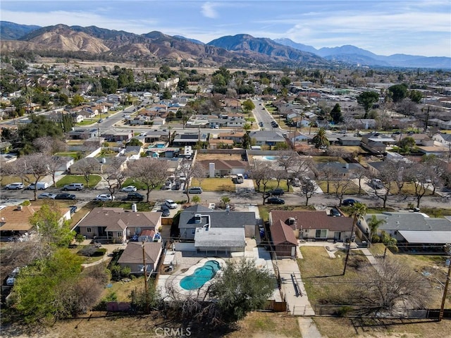 birds eye view of property with a mountain view