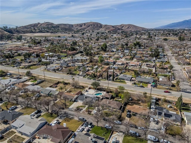 birds eye view of property with a mountain view