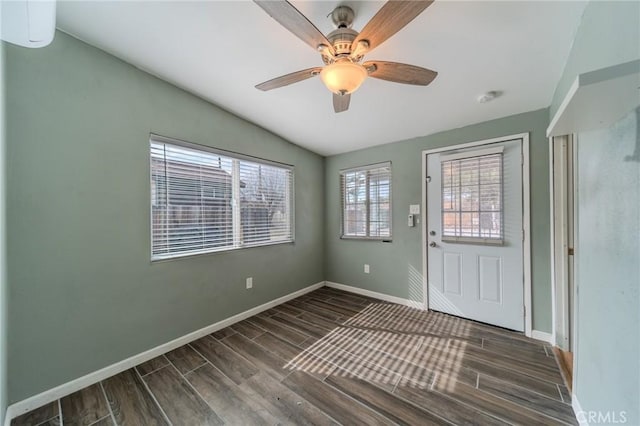 foyer featuring ceiling fan and vaulted ceiling