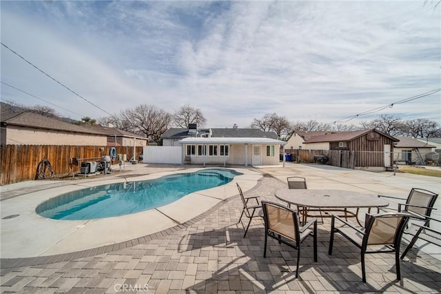 view of pool featuring a patio area and an outdoor structure