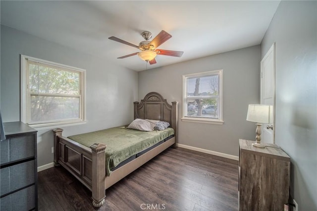 bedroom with dark wood-type flooring and ceiling fan