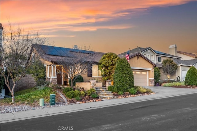 view of front of property featuring a garage