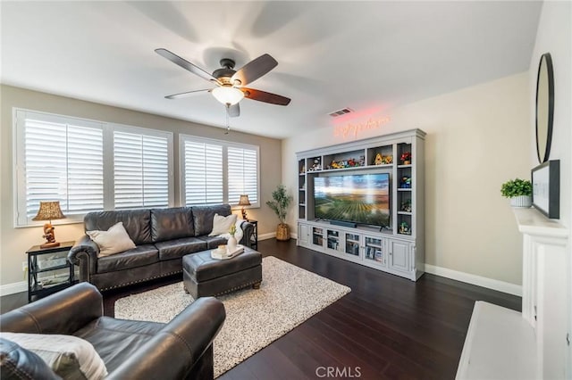 living room with dark hardwood / wood-style flooring and ceiling fan