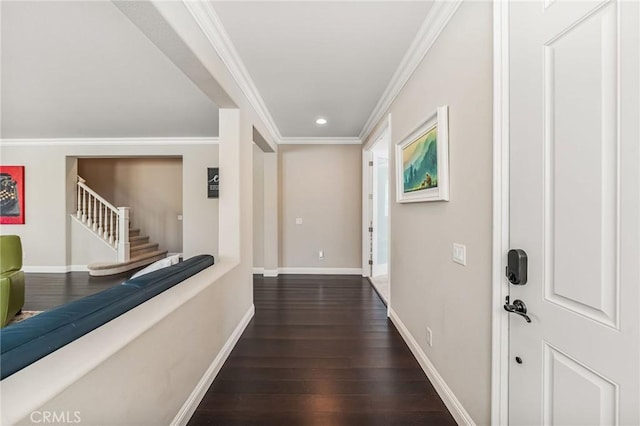 hallway with ornamental molding and dark hardwood / wood-style flooring