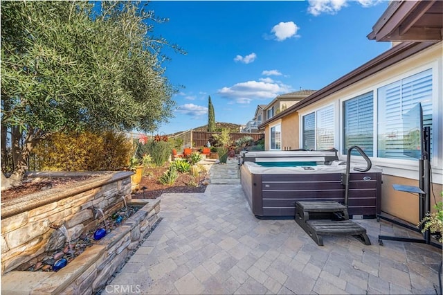 view of patio featuring a hot tub