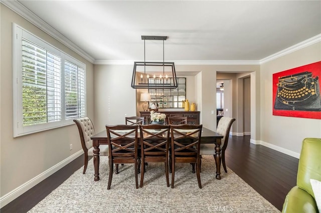 dining area with crown molding, a notable chandelier, and dark hardwood / wood-style flooring