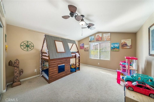 recreation room featuring ceiling fan, lofted ceiling, and carpet flooring