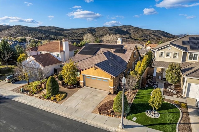 birds eye view of property featuring a mountain view