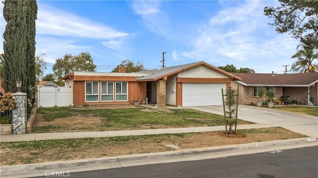 single story home with a gate, fence, a chimney, concrete driveway, and a garage