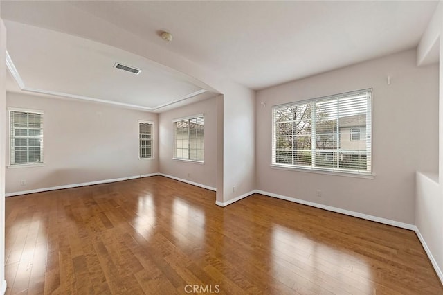 spare room with hardwood / wood-style flooring