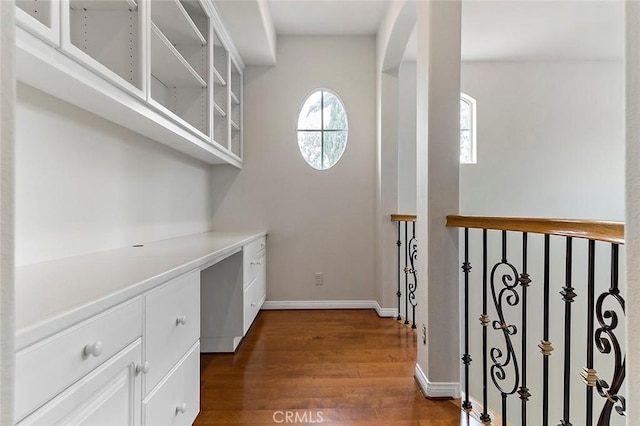 corridor featuring dark hardwood / wood-style floors