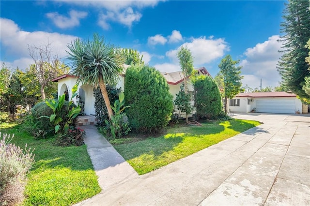 view of front facade with a garage and a front yard