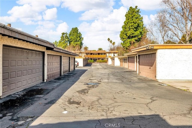 view of road with community garages