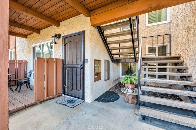 property entrance featuring stucco siding