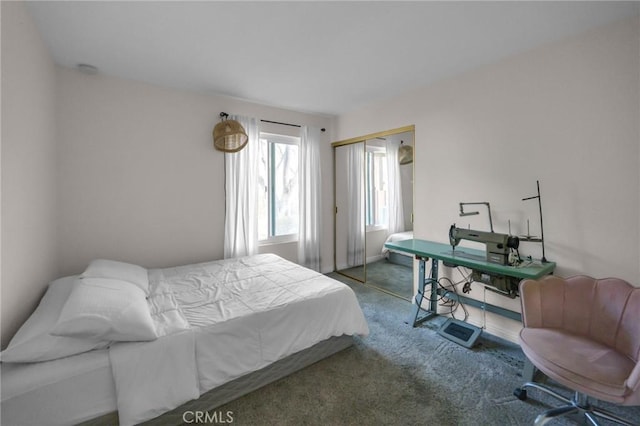 bedroom with a closet and dark carpet