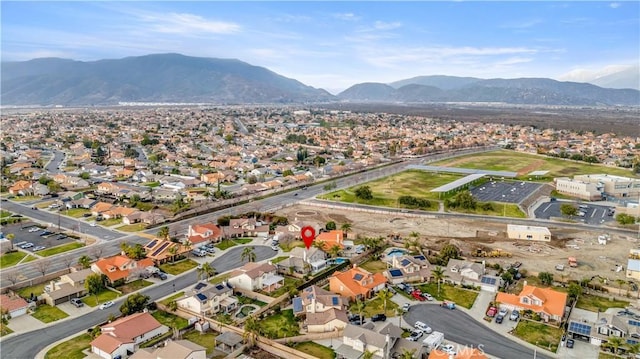 birds eye view of property with a mountain view