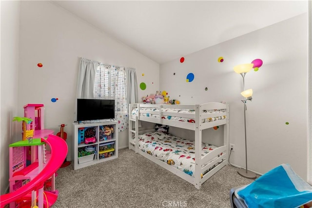 carpeted bedroom with vaulted ceiling