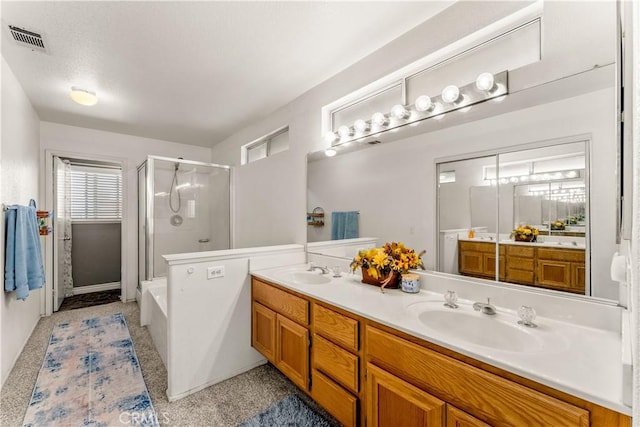 bathroom featuring independent shower and bath and vanity