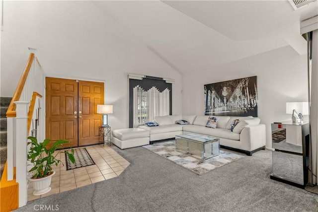 living room featuring carpet flooring and high vaulted ceiling