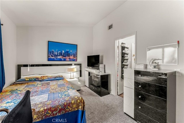 bedroom with light colored carpet